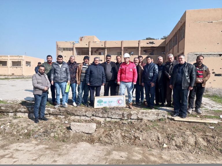 ADRA touring Al Tebni Secondary School with potential contractors for school rebuilding in Tebni, Deir ez-Zor