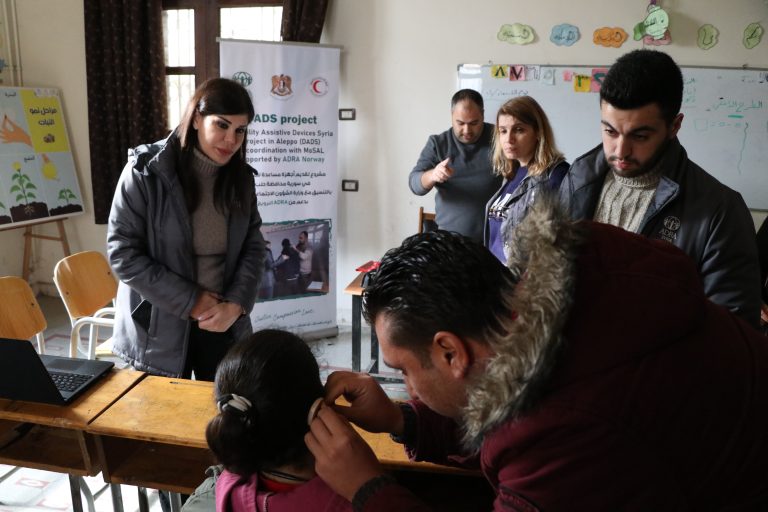 Calibrating hearing aides for children at Al Amal School, Aleppo