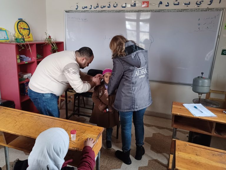 Taking ear prints for hearing aides for children at Al Amal School, Aleppo